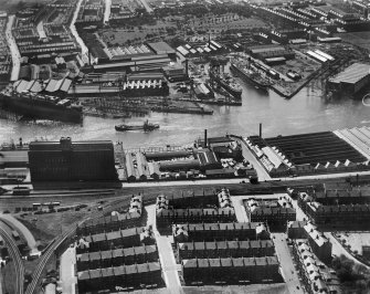 Glasgow, general view, showing Robinson Dunn and Co. Ltd. Partick Saw Mills and Meadowside Granary, Linthouse, Govan, Lanarkshire, Scotland, 1930.  Oblique aerial photograph taken facing south. Oblique aerial photograph  taken facing south.