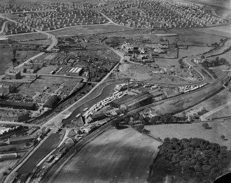 Robinson Dunn and Co. Ltd. Temple Saw Mills and Forth and Clyde Canal, New Kilpatrick, Dunbartonshire, Scotland, 1930.  Oblique aerial photograph taken facing north-west.