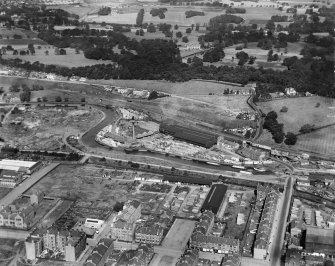 Robinson Dunn and Co. Ltd. Temple Saw Mills and Forth and Clyde Canal, New Kilpatrick, Dunbartonshire, Scotland, 1930.  Oblique aerial photograph taken facing north-west.