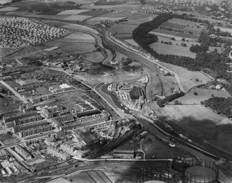 Robinson Dunn and Co. Ltd. Temple Saw Mills and Forth and Clyde Canal, New Kilpatrick, Dunbartonshire, Scotland, 1930.  Oblique aerial photograph taken facing north-west. This image has been produced from a damaged negative.