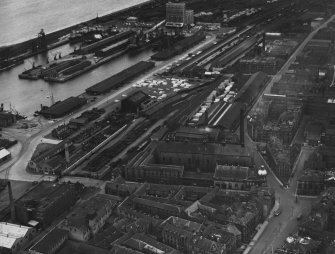 Edinburgh, general view, showing Edinburgh Dock and Baltic Street. Leith, Edinburgh, Midlothian, Scotland, 1932.  Oblique aerial photograph taken facing east.  This image has been produced from a print.