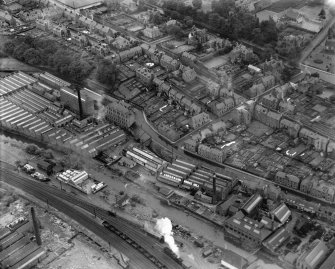 General view, showing Peter Anderson Ltd. Bridge Mill, Huddersfield Street and Gala Water, Galashiels, Selkirkshire, Scotland, 1939.  Oblique aerial photograph taken facing south. 