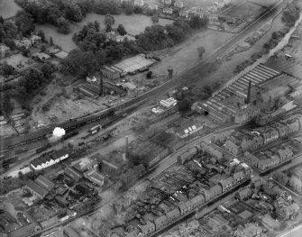 General view, showing Peter Anderson Ltd. Bridge Mill, Huddersfield Street and Gala Water, Galashiels, Selkirkshire, Scotland, 1939.  Oblique aerial photograph taken facing east. 