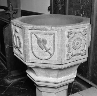 Font from Kinkell Old Parish Church now in St John's Episcopal Church, Aberdeen.
Detail of panels bearing a) shield charged with the heart pierced by a sword, and b) a rose.
