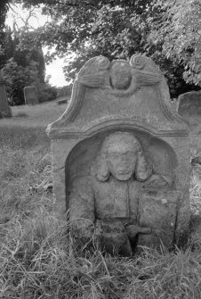 View of headstone commemorating Horsburgh (died 1735) with portrait of man holding book.