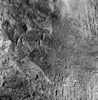 Incised human figure on SW wall, King's Cave, Arran.