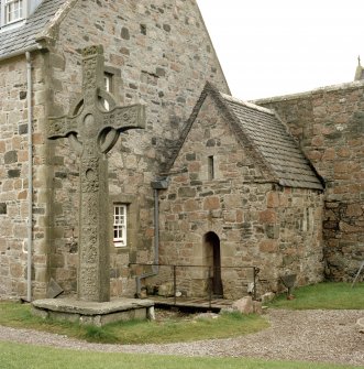 View of the replica St John's Cross in the original base in front of St Columba's Shrine, Iona Abbey.