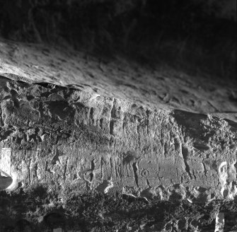 View of runic inscription in St Molaise's Cave, Holy Island.