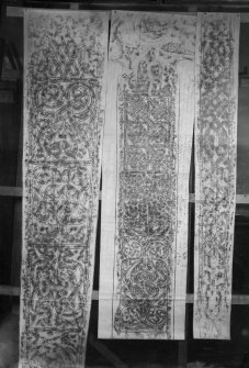 Photographic copy of three rubbings. The middle rubbing depicts the front shaft of Keills Cross. The left and right rubbings shows the left and front side of Thornhill cross.