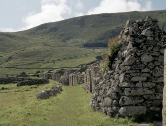 St Kilda Village. General view to the west with the gable of Blackhouse E in the foreground.