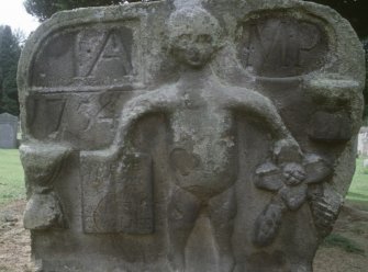 Detail of headstone dated 1754 with figure of man, Gladsmuir Old Parish Churchyard.