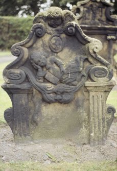 View of headstone to John Mill 1693 showing boy with book,Tranent Parish Church Burial Ground.