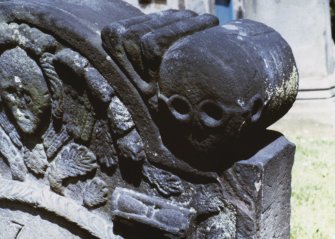 Detail of headstone to Margaret Shield d. 1727, with winged soul and skulls, Kirkliston Parish Churchyard.