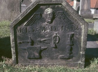 View of headstone dated 1750 and 1852 showing anvil, trumpet and hourglass, Kilsyth Burial Ground.
