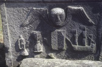 Detail of headstone showing winged soul, hourglass and ship Kilsyth Burial Ground.