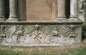 Detail of monument showing skulls, Kilwinning Abbey Churchyard.