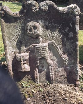 View of headstone to John Gallon d.1684 with skeleton and hourglass, St Ninian's Churchyard, Lamington.