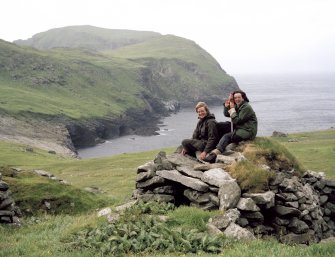 St Kilda, Gleann Mor. A cleit at the Amazon's House with two volunteers.