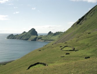 St Kilda, Village Bay. General view of the enclosures at Gearraidh Ard with Dun in the background.