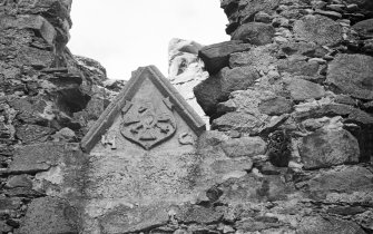 Glenbuchat Castle. Detail of pediment reset in room over kitchen.