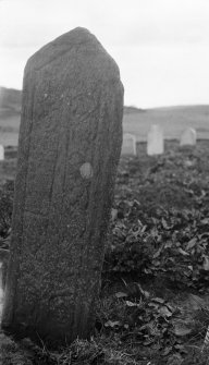 Skye, Glen Dale, St Comgan's Chapel. View of late medieval graveslab, reused as headstone and set inverted in ground.