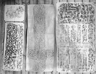 Photographic copy of four rubbings. The right rubbing shows the Apostles Stone cross slab, Dunkeld Cathedral. The remaining stones are unidentified.