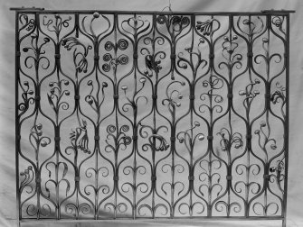 View of wrought iron grille decorated with scrolls and berries, possibly for Ardkinglas House