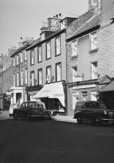 General view of 63, 67 and 69 High Street, Dunbar, from S including St George Hotel, George Low and Son, a chemist and George Hurry tea room.