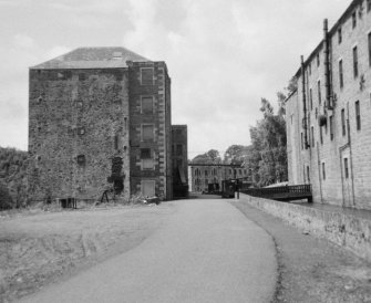 View of south east elevation of Mill No.3 with Mill No.1 in distance, New Lanark.