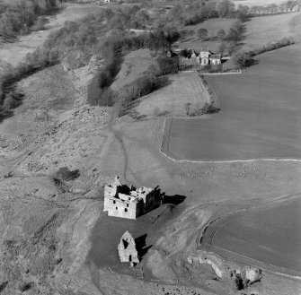 Oblique aerial view of Crichton Castle with Crichton Parish Church visible.
