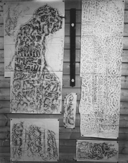 Photographic copy of five rubbings. The upper left rubbing shows the face of the Apostles Stone cross slab in Dunkeld Cathedral, the remaing stones are unidentified.
