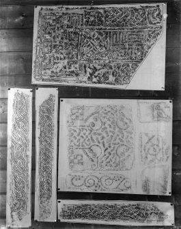 Photographic copy of five rubbings. The middle right rubbing shows details of a cross slab in St Serf's Church, Dunning and the remaining rubbings shows details of a cross slab from Rothesay Castle, now in Bute Museum.