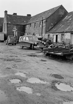 General view of Millbank foundry, Thurso, with cars outside.
