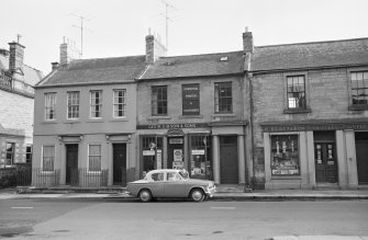 View from north west of High Street, Coldstream, showing Geo W Gibson & Sons Commercial Printers and Stationers and R Scott & Son Booksellers