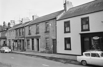 View from west of High Street, Coldstream, showing Geo W Gibson & Sons Commercial Printers and Stationers and R Scott & Son Booksellers