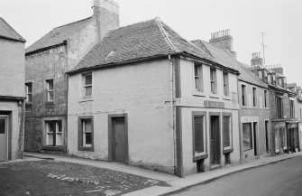 View of 8 Castle Street, Duns, from north west showing A Mabon tobacconist and confectioner and a home decorator shop.