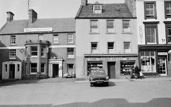 View of 28-34 Market Square, Duns, from south showing White Swan Hotel, D Porter and Son jewellers and opticians and the County Restaurant