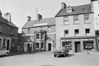 View of 31-34 Market Square, Duns, from south showing White Swan Hotel and D Porter and Son Jewellers and Opticians