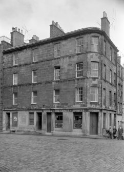 View of the corner of 124, 126, 128 Pleasance and 1 Salisbury Street, Edinburgh seen from the south west, showing The Crags pub.