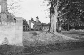 View from main road from west of the Lion Gate and  West Lodge, Ladykirk House