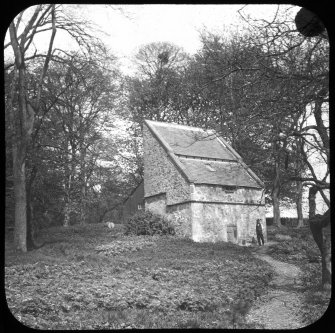 View of the dovecot at Tulliebole from SW, with the figure of a man in front.