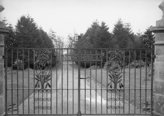 View of wrought iron gates at entrance to Newhall House, Carlops