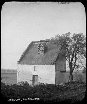 View of the dovecot at Findrassie from SSE, with roof intact and dormer entrances for pigeons.
