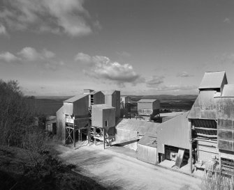 View from SE of W end of lime works, which includes storage hoppers, and grading and conveying machinery