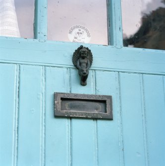 Front door, angel door-knocker and letter-box (inscribed:'M.S.Boyd - Sculptor'), detail
