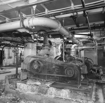 Interior view of Carbonation and Recovery Basement, showing the Carbon Dioxide Gas Compressors which supplied the gas for the Carbonation Plant Saturators.  The Carbon Dioxide was supplied from the flue gases from the refinery's main boilers (T&L No.: 21177/11)