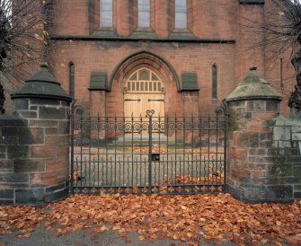 Entrance front, wrought-iron gate, piers and main door, detail