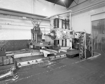 Motherwell, Craigneuk Street, Anderson Boyes
Machine Shop (Dept. 21, built 1954): Interior view from south west at east end of north bay, showing a horizontal boring machine working on the down-drive wheel-housing for a large coal-cutting machine destined for Queensland, Australia - the last machine to be made by the company in Motherwell.