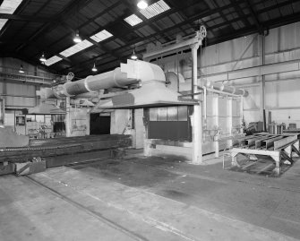 Motherwell, Craigneuk Street, Anderson Boyes
Heat Treatment (Dept. 12, east bay, built 1981): Interior view from SW showing two Gibbons Heating Ovens (fired by ordinary natural gas), separated by an oil quenching tank.  Note that the furnaces are loaded and unloaded using a rail-mounted traverser.