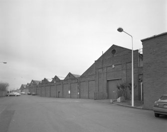 Motherwell, Craigneuk Street, Anderson Boyes
Exterior view from south west of machine shop bays, the nearest bays (right) dating from the opening of the works in 1899, the further bays originating from a sequence of expansions in 1912, 1922, 1924 and 1954